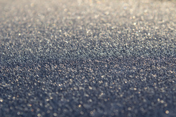 Fototapeta na wymiar Frost on the car. Details of the car. Getting the sun and frost. Early spring Sunrise Morning.