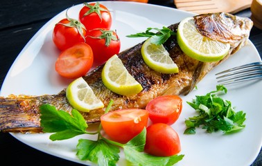 Fried fish served on the plate