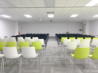 Empty clean room with chairs and tables for training,meeting 