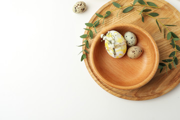 Obraz na płótnie Canvas Festive Easter table setting with eucalyptus and eggs, flat lay. Space for text