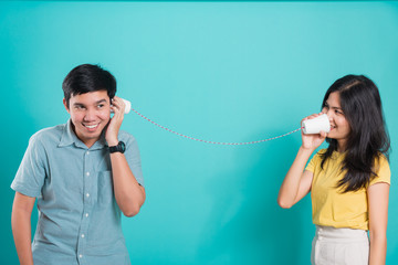 couple beautiful handsome smile and talking together with paper can telephone