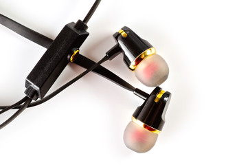 Vacuum headphones in black with a headset, shot on a white background. Background for music and...