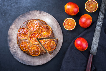 Traditional American upside-down bloody orange cake offered as closeup on a modern design plate