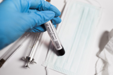Coronavirus blood test. Doctor holding a test tube. 2019-nCoV. Covid.