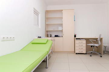  clean and comfortable room in the hospital  on background. doctor's office. doctor's room close up with copy space for text. hospital check-ins 