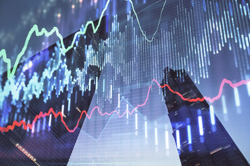 Forex chart on cityscape with tall buildings background multi exposure. Financial research concept.