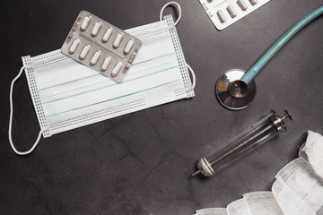 Coronavirus test, thermometer, pills, stethoscope,  laboratory desk. 2019-nCoV