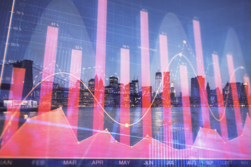 Financial graph on night city scape with tall buildings background double exposure. Analysis concept.