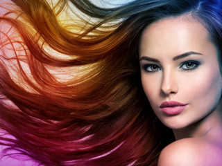 Beautiful woman with long brown hair. Tinted art photo