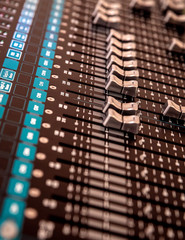 audio mixer in the studio for mixing audio from different musical instruments and voice