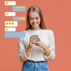 Cute millennial girl communicating in chat on pink background, empty space