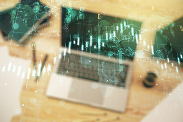Double exposure of abstract creative financial diagram with world map on computer background, banking and accounting concept