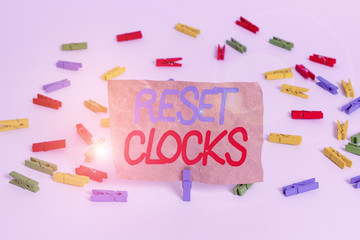 Text sign showing Reset Clocks. Business photo text To revisit return to or recreate a time or era...