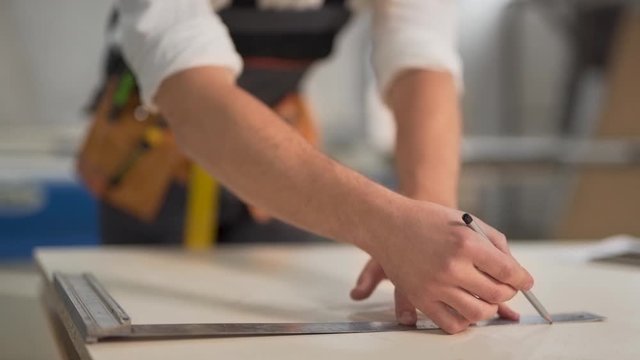closeup, joiner draws a line at a corner