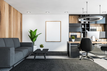 White and wood CEO office with vertical poster