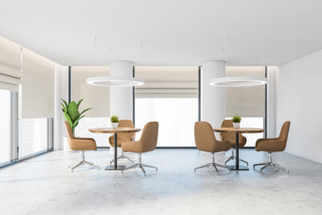 White office lounge area with beige chairs