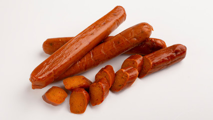 Food swap. Meat free sausage on white background