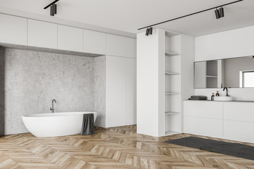 White loft bathroom corner, tub and sink