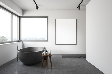 White bathroom with stone tub and poster