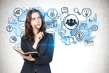 Woman with notebook and business icons