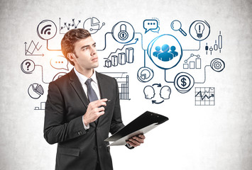 Pensive man with clipboard and his business plan