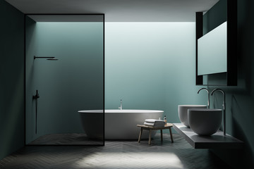 Fototapeta na wymiar Green bathroom with tub, shower and sinks