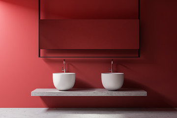 Double sink in red bathroom interior