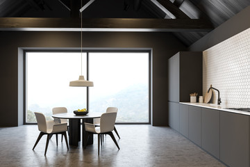 Luxury attic kitchen with countertops and table