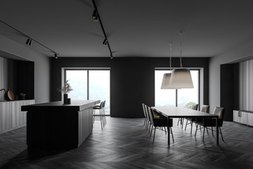 Gray kitchen with island and table, side view