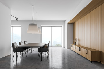 White and wooden dining room with cabinet