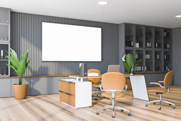 Gray CEO office corner with bookcase and poster