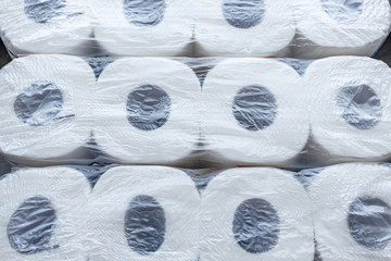 Background of toilet paper rolls in a package. Top view.