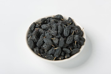 Raisins of all colors mixed and dried in isolation on a white background