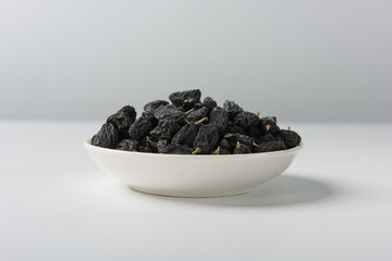 Raisins of all colors mixed and dried in isolation on a white background