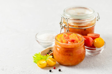 Vegetarian preserves, mixed vegetable salad in glass jar. Selective focus, copy space.