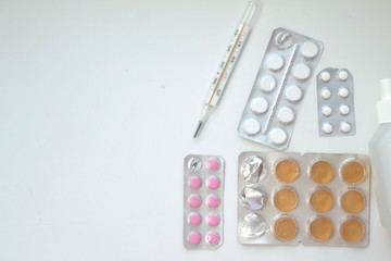 Background of pills and thermometer: pandemic virus infection from Wuhan, China, novel Coronavirus outbreak.
