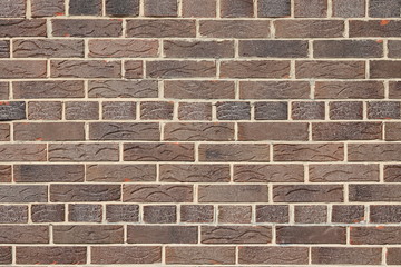 Brown background of beautiful unusual building brick