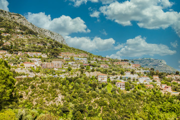 Fototapeta na wymiar Many homes on a hillside overlooking Eze, France