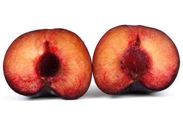 Halves of black plum