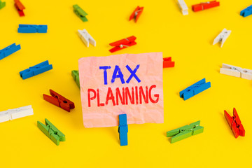 Handwriting text Tax Planning. Conceptual photo man of financial situation or plan from a tax perspective Colored clothespin papers empty reminder yellow floor background office