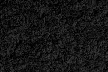 Fototapeta premium Abstract black background. Black stucco texture. Dark rough surface.