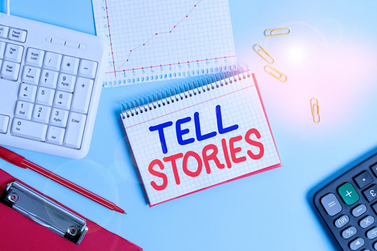 Writing note showing Tell Stories. Business concept for formal to tell someone about something that has happened Paper blue keyboard office study notebook chart numbers memo