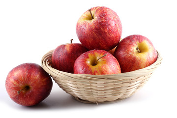 Gala apples on wicker plate