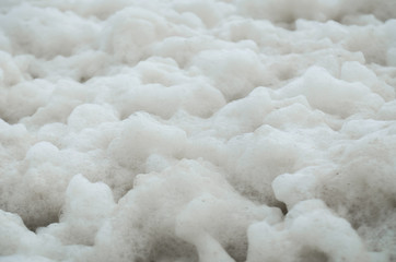 Abstract close-up of a lot of sea foam on the shore. Ecology. - 330474193
