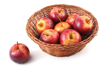 Red little apples on wicked plate