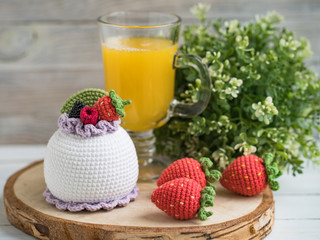 Knitted cakes. Concept. Sweet tooth.Stylization. Needlework. Environmentally friendly toys for children to develop fine motor skills. Hand made toys. 