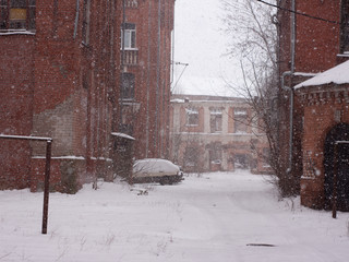 old red brick houses in heavy snowfall