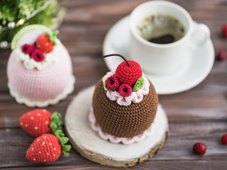 Knitted cakes. Concept. Sweet tooth.Stylization. Needlework. Environmentally friendly toys for children to develop fine motor skills. Hand made toys. 