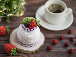 Knitted cakes. Concept. Sweet tooth.Stylization. Needlework. Environmentally friendly toys for children to develop fine motor skills. Hand made toys. 