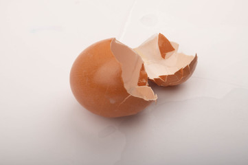 The shell of a broken chicken egg on a white background. Close up.